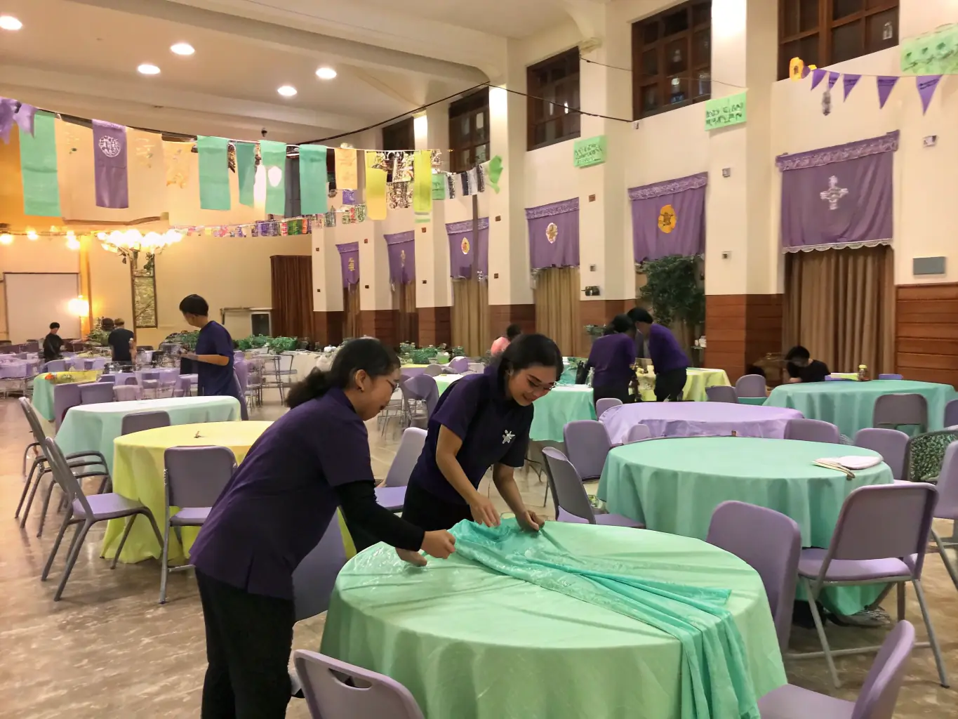 A dynamic image depicting museum staff and volunteers actively involved in organizing and hosting a cultural event, showcasing the vibrant cultural initiatives supported by the ASSOCIATION DES MUSÉES BOURBONNAIS.